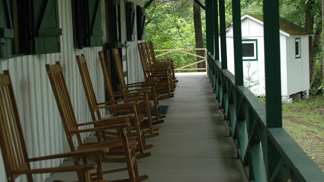 long porch with rocking chairs