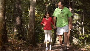 Father and daughter on a hiking trail