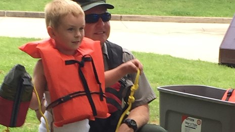 ranger and boy with life jacket