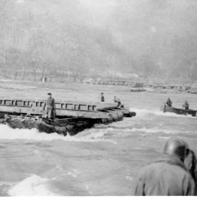 historic photo of soldiers constructing a bridge