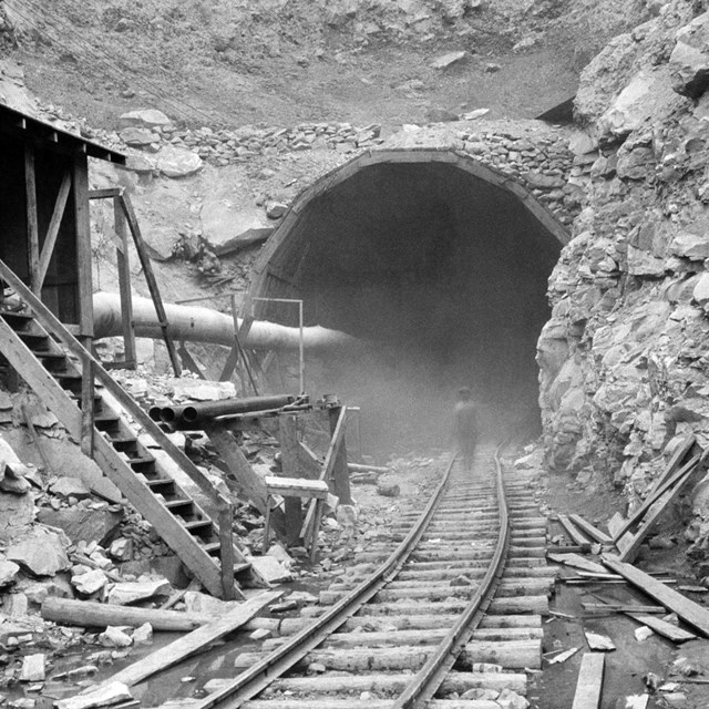 worker entering tunnel