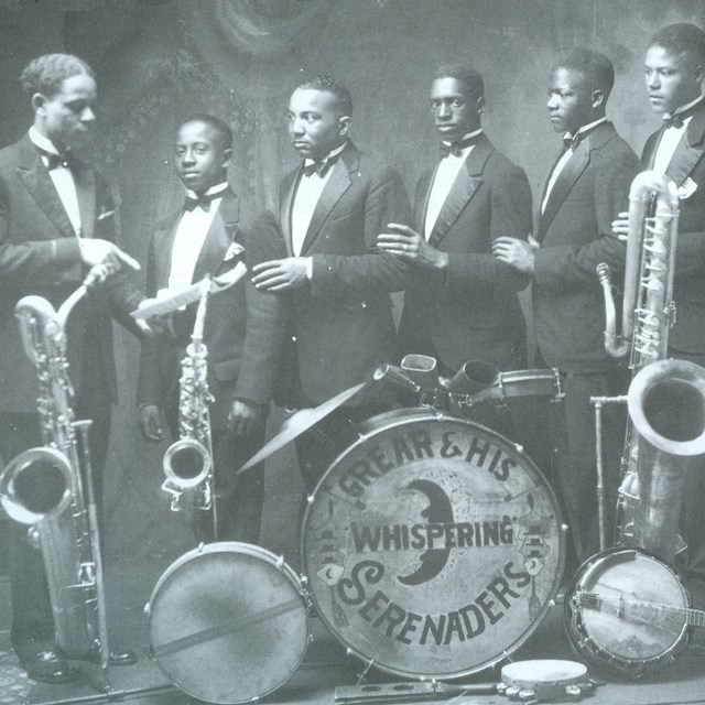 black and white  photo of members of a band