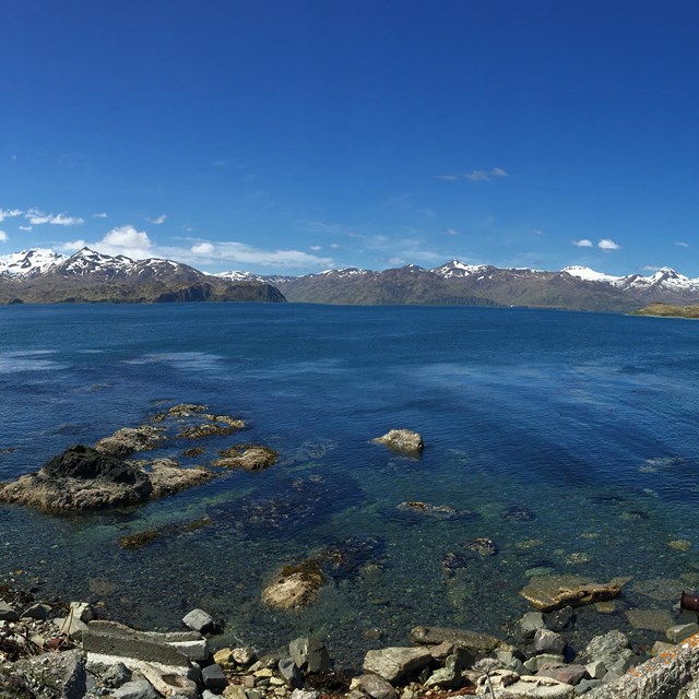Seascape with Aleutian island in the distance.