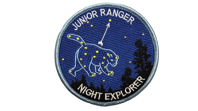 The Junior Ranger Night Explorer badge features an embroidered Ursa Major constellation