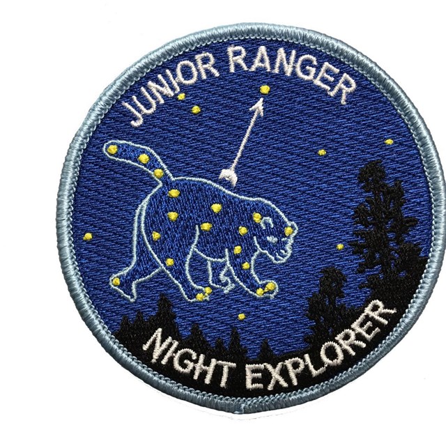 The Junior Ranger Night Explorer badge features an embroidered Ursa Major constellation