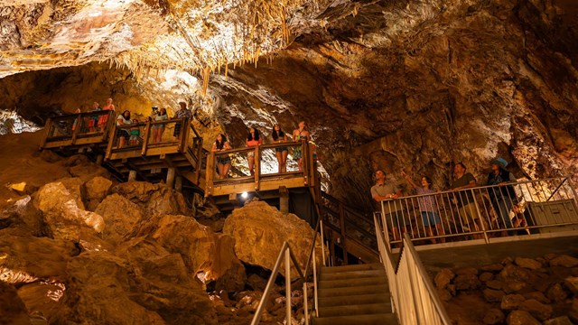 Glencoe Caves staircase with people
