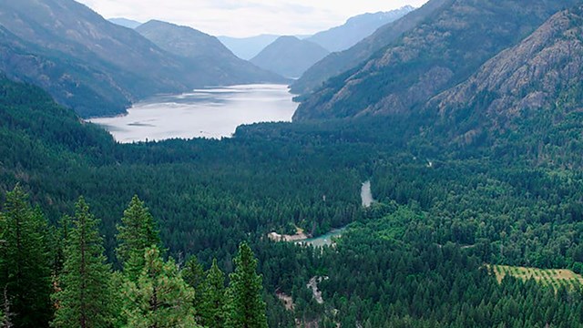 Sweeping views of a lake surrounded by mountains.