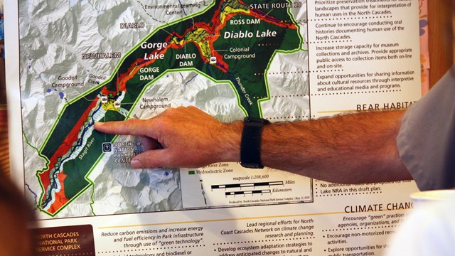 hand pointing at a map