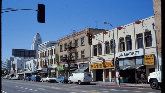 Historic color photo of a city block that is part of the Little Tokyo District