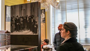 Visitor looking at a museum about the suffrage movement