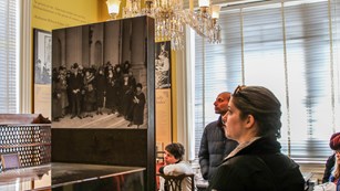 Visitor in a museum exhibit about women suffragists