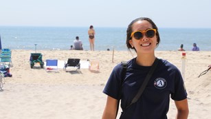 AmeriCorps volunteer standing on a beach