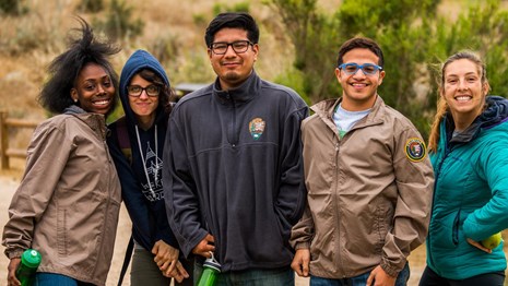 A group of youth standing outside