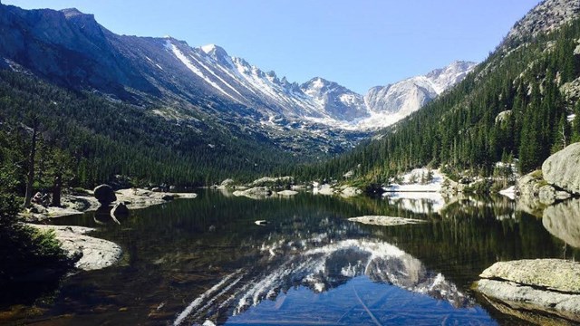 Mountain range and its reflection in a lake