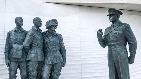 Statue of Dwight D. Eisenhower talking to soldiers