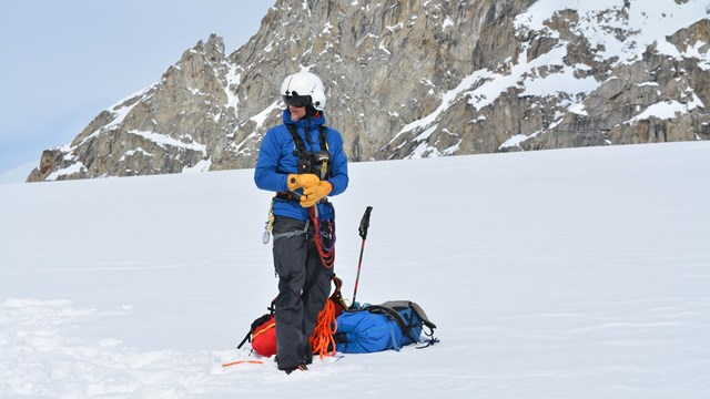 Mountaineer beginning to set up basecamp gear