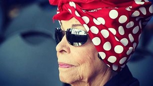 Woman wearing a Rosie the Riveter bandanna on her head