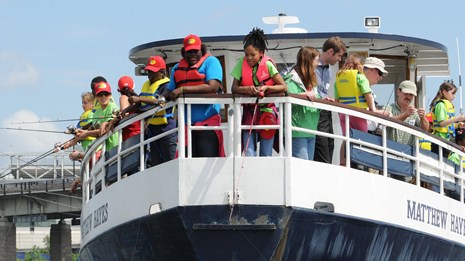 Group of kids on a boat stern