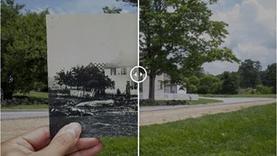Hand holding up a historic image of a building over top the current building