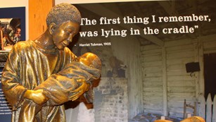 Statue of a baby Harriet Tubman being held by her mother