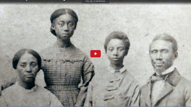 Screenshot of a video showing a historical portrait of a family