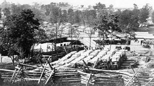 Historic black and white photo of a 19th-century military camp