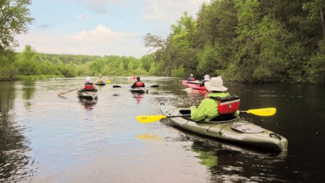 Group of kayakers on a wide river