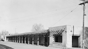 Black and white historical photo of the Governors Palace in Santa Fe