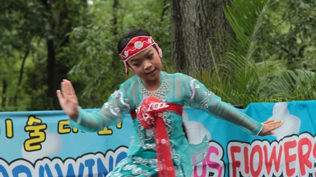 Asian American dancer at a festival