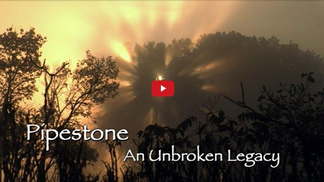 Video screenshot of a sky with text reading "Pipestone An Unbroken Legacy"