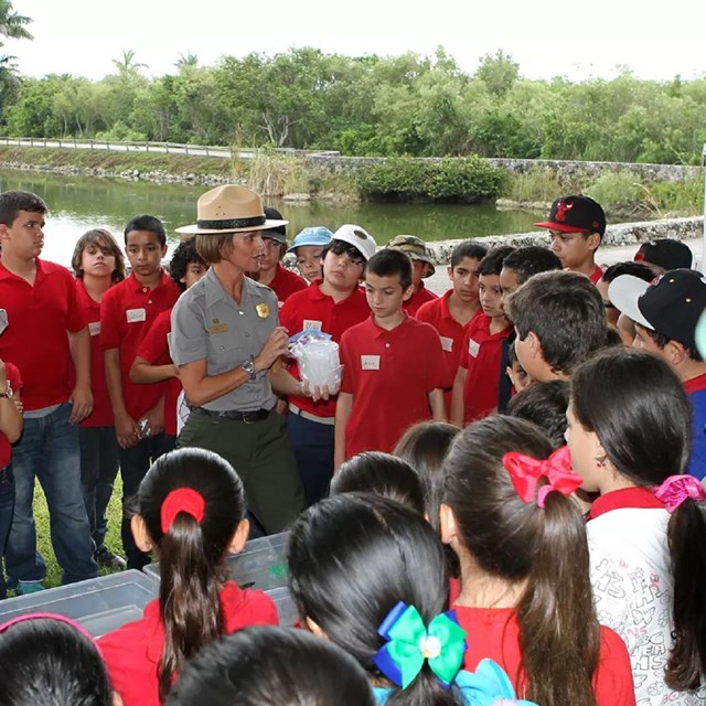Ranger Yvette talking to a large group of students