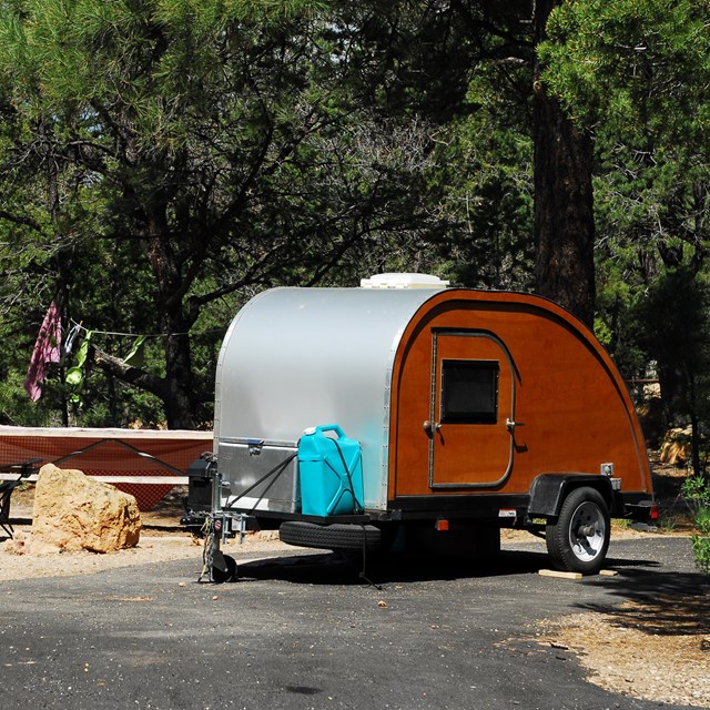 Old-fashioned RV parked in a campground 