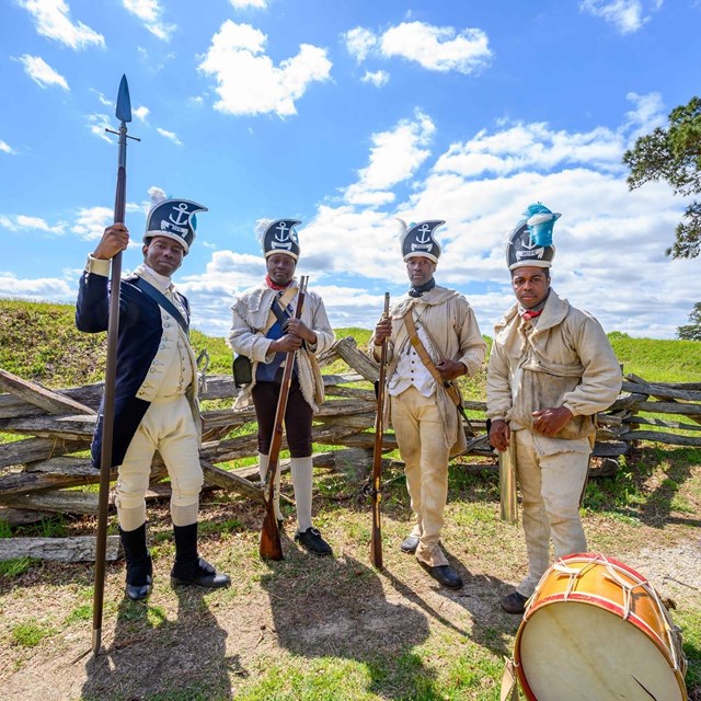 Reenactors dressed as the 1st Rhode Island Regiment of the Revolutionary War