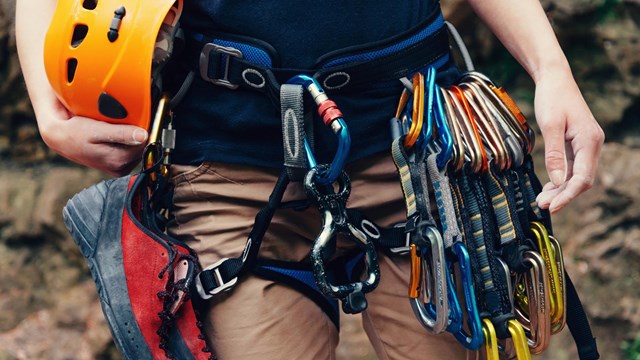 A close-up of rock-climbing gear on a person.