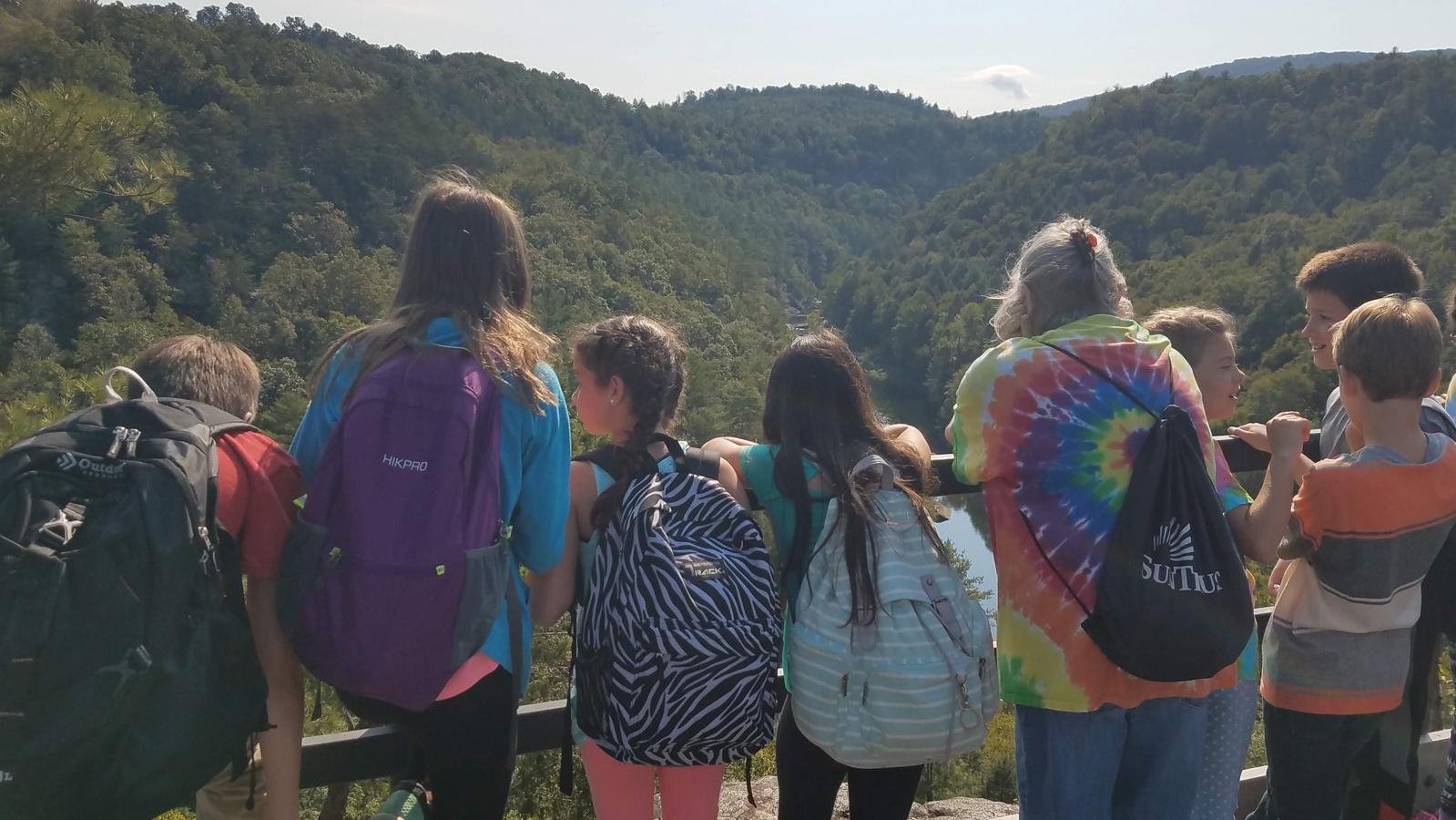 A group of kids at Lilly Bluff overlook.