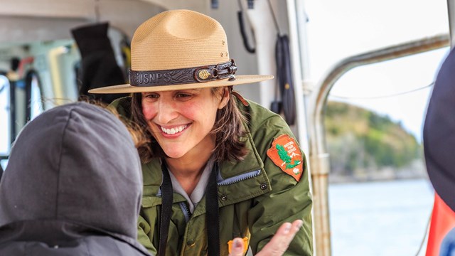 Park ranger directs visitor.