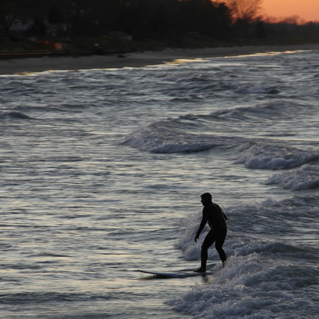 A man surfs