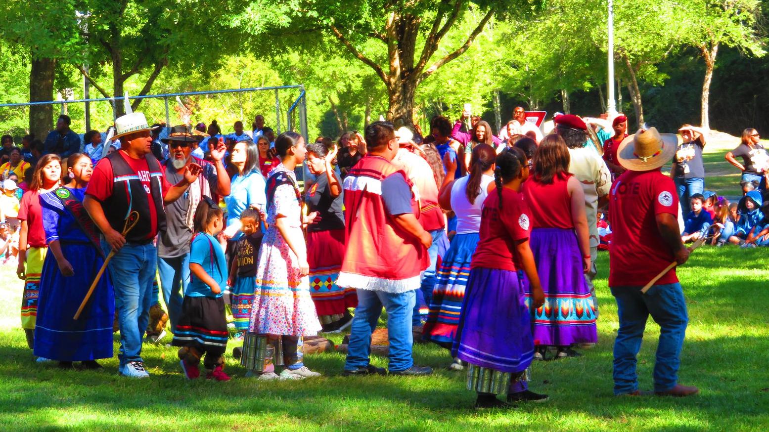 Participants dancing in a circle