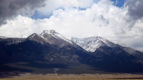 mountains with white clouds above