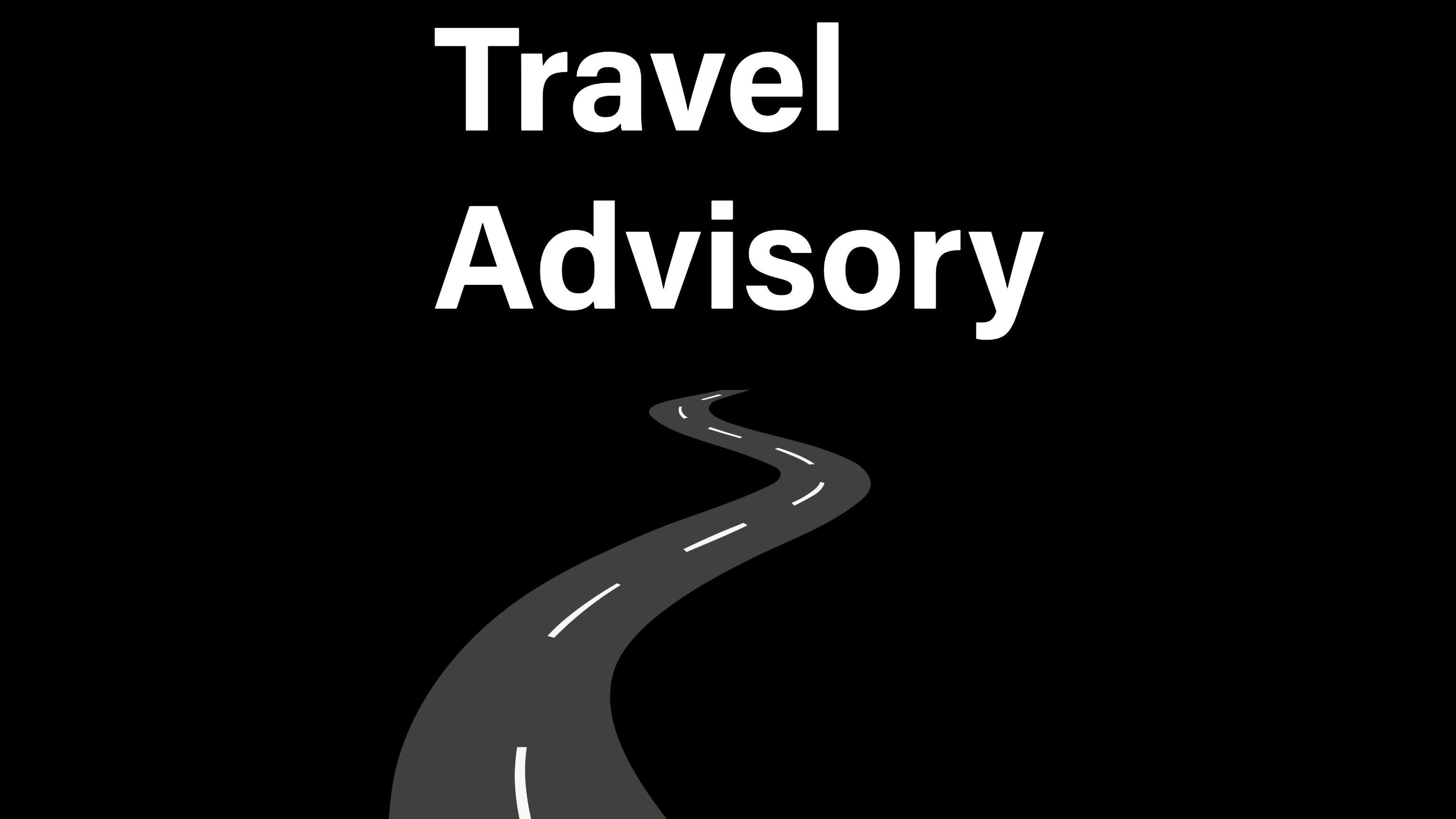 A road winding into the distance below the words "Travel Advisory"