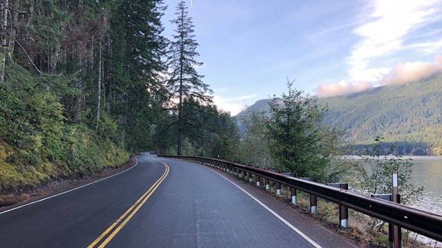 An empty road leads along Crescent Lake.