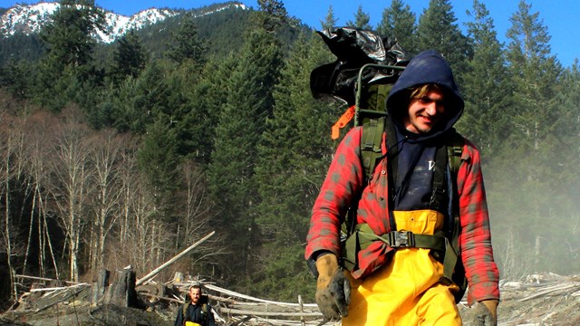 Man backpacking on the coast