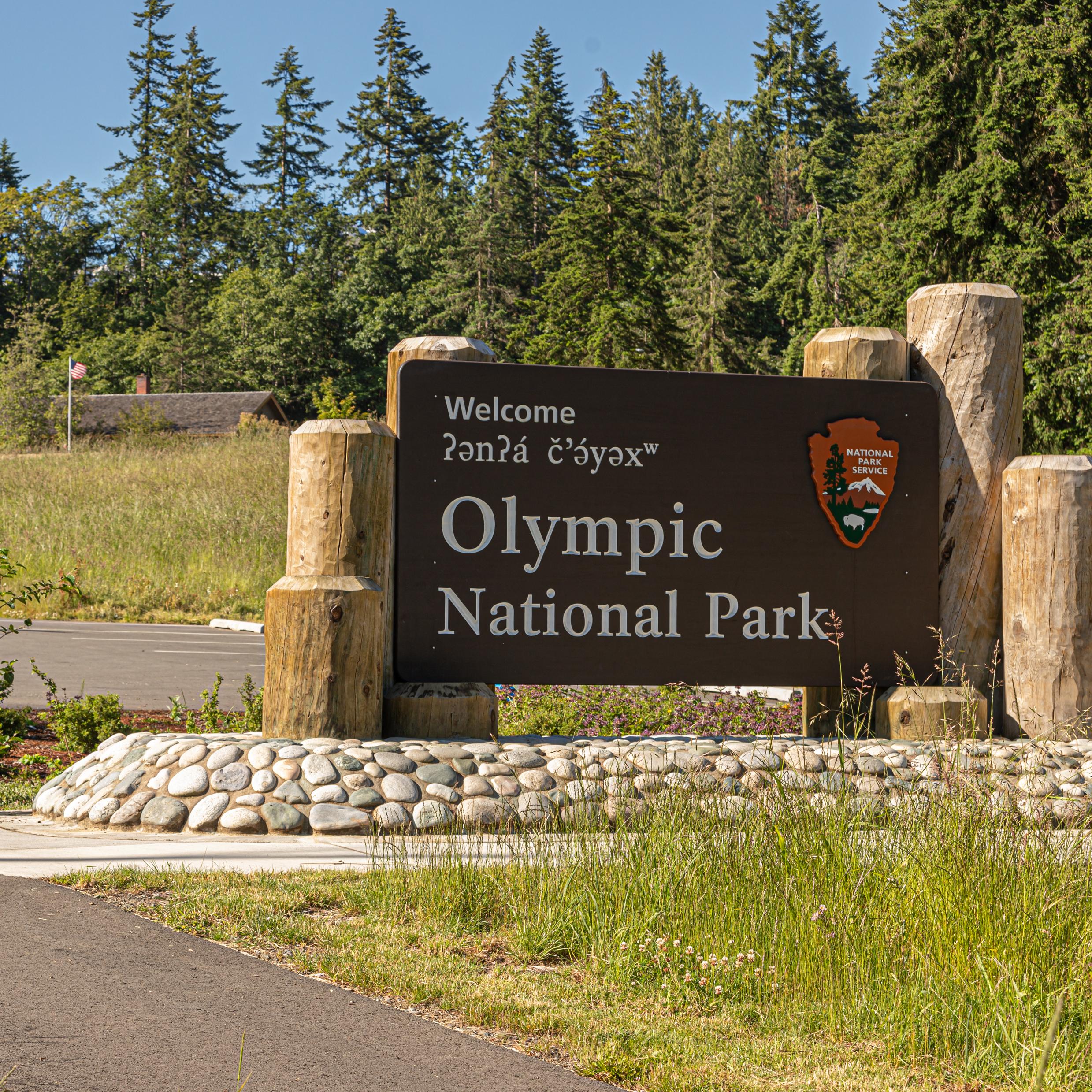 A brown wooden sign reads 