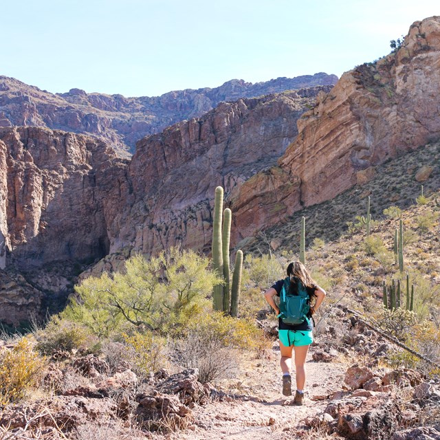 woman hiking on a desert trail