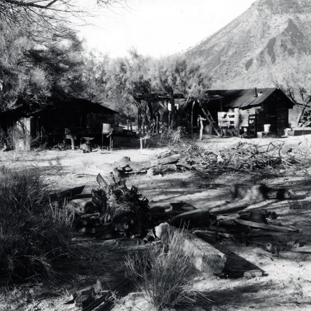 A black and white picture of the wooden shacks of Bonita Well