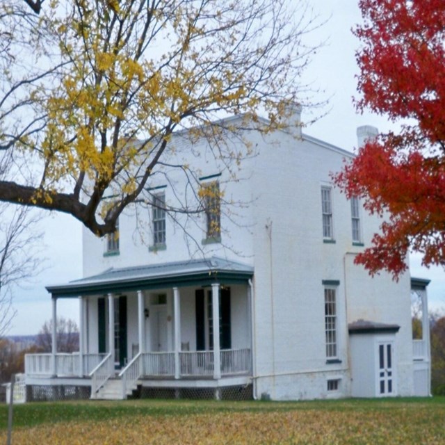 A white two story farmhouse