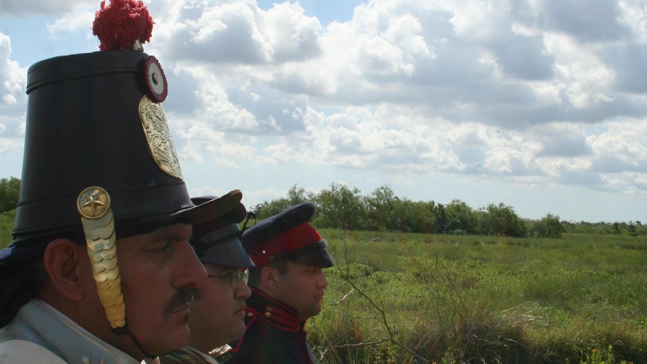 Living historians dressed in Mexican War era military uniforms