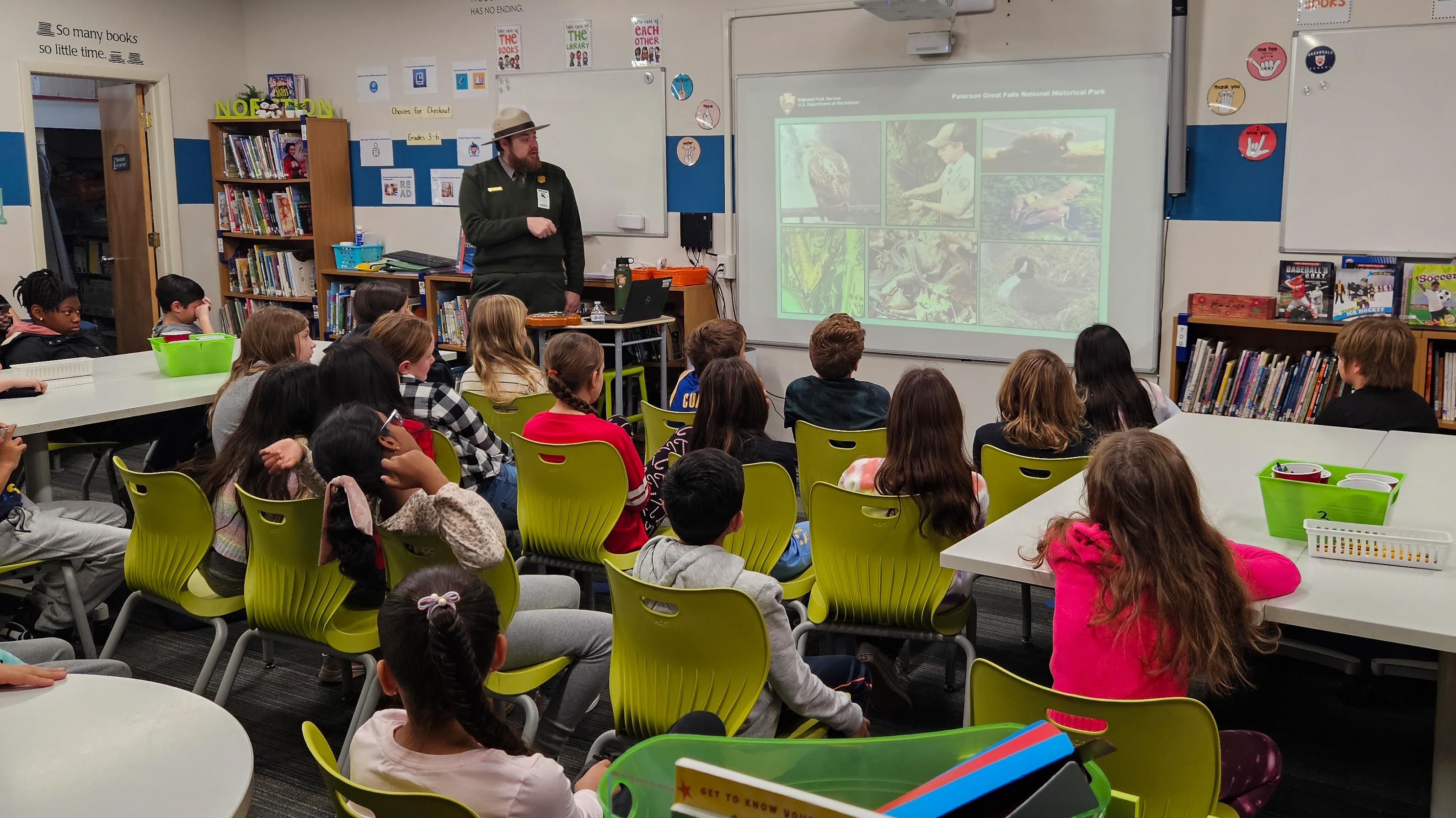 A Park Ranger presenting to a classroom of students