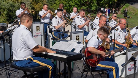 Picture of the United States Army jazz band performing at the park.