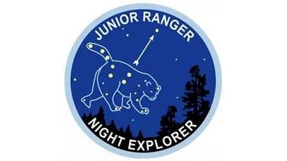 Junior Ranger patch has blue background with a bear outline and stars showing the Big Dipper
